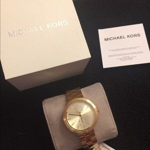 Michael Kors woman’s MK6408 watch gold-tone